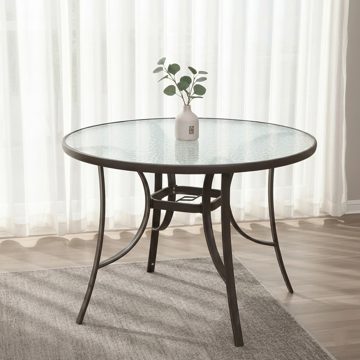 Round metal outdoor table with glass top - black