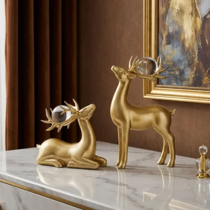 Ensemble de 2 sculptures de rennes dorés – Figurines d'élans en résine de qualité supérieure pour la décoration de Noël, idéal pour le salon, le bureau, la chambre, la présentation sur étagère, décoration de fête pour Noël (doré)