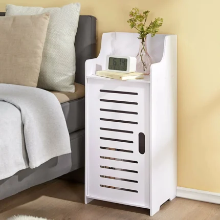 Narrow White Floor Cabinet with Slatted Door and Open Top Shelf - Compact Wooden Storage Organizer for Bedroom, Bathroom, or Living Room.