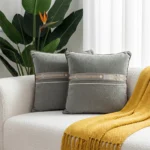 Sage Green Velvet Decorative Throw Pillow with Embroidered Geometric Band and Textured Detail.
